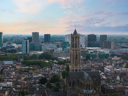 Aerial View of Utrecht Featuring Dom Tower and Cityscape at Sunsetの写真素材
