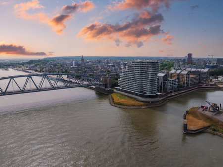 Aerial View of Nijmegen with Waal River and Steel Bridge at Sunsetの写真素材