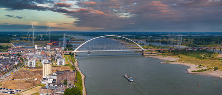 Aerial View of De Oversteek Bridge and Waal River in Nijmegenの写真素材