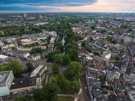 Aerial View of Utrecht with Canals, Dom Tower, and Sunset Skyの写真素材