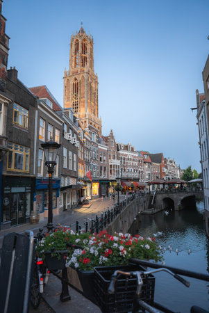Dom Tower and Canal with Bridge in Utrecht, Netherlands at Nightの写真素材