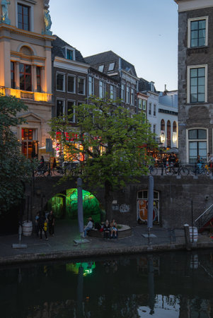 Evening Canal Scene with Historic Buildings in Utrecht, Netherlandsの写真素材