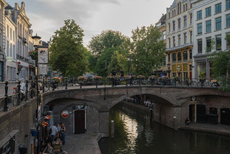 Historic Canal with Brick Bridge and Flower Boxes in Utrecht, Netherlandsの写真素材