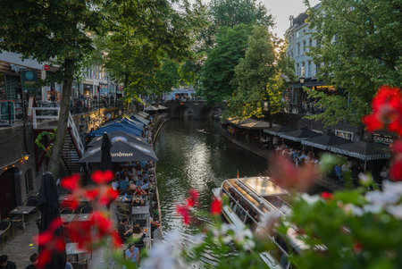 Canal in Utrecht, Netherlands with Restaurants and Bridge Viewの写真素材