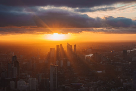 Sunset Over London Skyline with Canary Wharf and River Thamesの写真素材