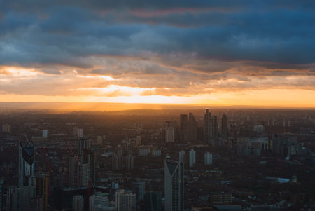 London Skyline at Sunset with Dramatic Clouds and Skyscrapersの写真素材