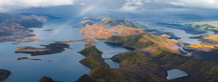 Aerial View of Icelands Rainbow Mountains, Lakes, and Rainbowの写真素材