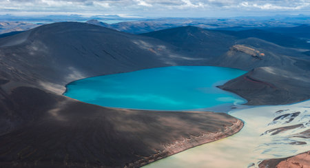Aerial View of Turquoise Crater Lake and Volcanic Terrain in Icelandの写真素材