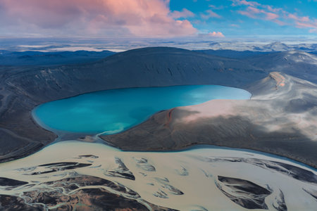 Aerial View of Turquoise Crater Lake in Volcanic Terrain, Icelandの写真素材