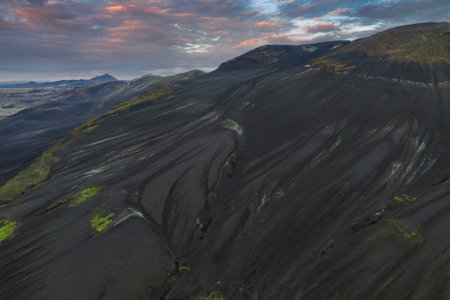 Aerial View of Volcanic Slope with Green Moss in Iceland at Sunsetの写真素材