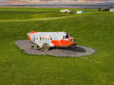 Abandoned Red and White Airplane on Gravel Patch in Iceland