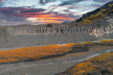 Dramatic Icelandic Landscape at Sunset with Rugged Cliff Face