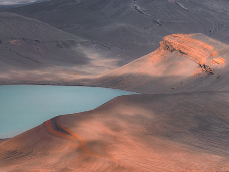 Turquoise Crater Lake and Volcanic Hills in Iceland at Sunsetの写真素材