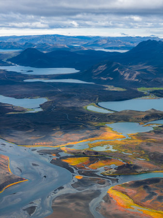 Aerial View of Icelandic Rivers, Moss Covered Terrain, and Volcanic Hillsの写真素材