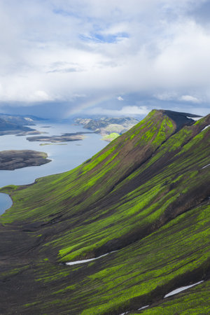 Aerial View of Volcanic Mountain Slope and Lake in Icelandの写真素材