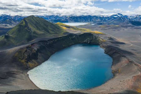 Aerial View of Volcanic Crater Lake and Rugged Terrain in Icelandの写真素材