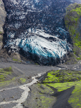Icelandic Glacier with Volcanic Ash and Mossy Slopesの写真素材