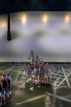 Young Dancers Perform Choreographed Routine on Brightly Lit Stage