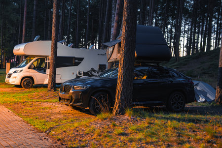 Black 2025 with Rooftop Tent in Forested Camping Area