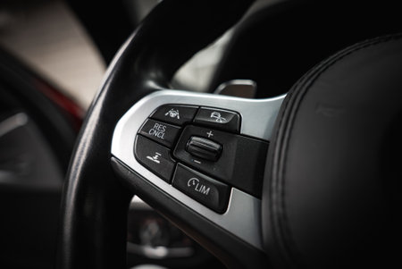 Close Up of Steering Wheel Controls in a Luxury Car Interior