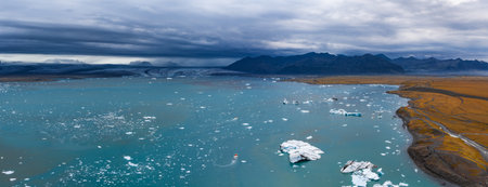 Aerial View of Jokulsarlon Glacier Lagoon with Icebergs and Boat