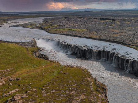 Aerial View of Dettifoss Waterfall Cascading into Rocky Riverbed in Iceland