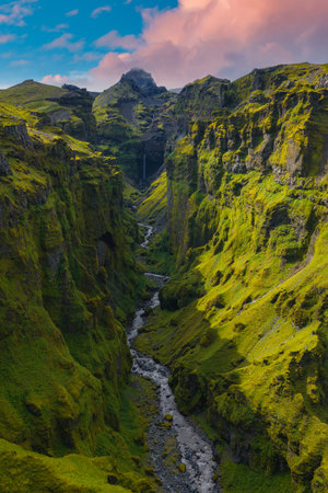 Aerial View of Mulagljufur Canyon with Waterfall and Mossy Cliffs