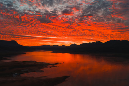 Aerial View of Sunset Over Calm Water and Mountains in Iceland