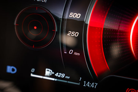 Close Up of Digital Car Dashboard with Torque Gauge and Indicators