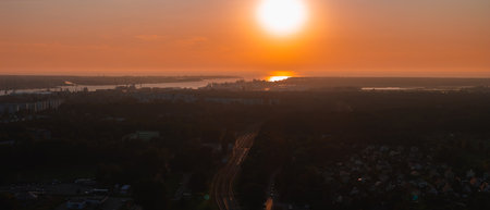 Sunset Over Riga with Daugava River and Riga TV Tower Silhouetteの写真素材
