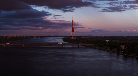 Sunset View of Riga TV Tower and Daugava River with Bridgeの写真素材