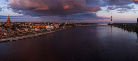 Sunset View of Riga with Daugava River and Iconic Landmarks