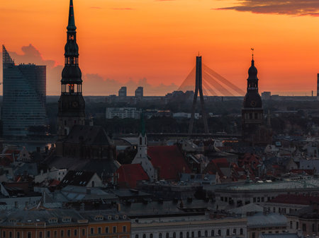 Sunset Over Riga with St. Peters Church and Vansu Bridgeの写真素材