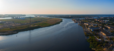 Aerial View of River and Industrial Areas in Riga at Sunsetの写真素材