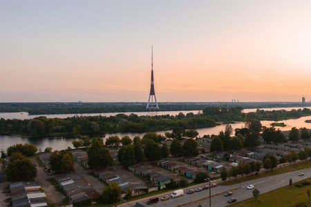 Sunset View of Riga TV Tower and Daugava River in Latviaの写真素材