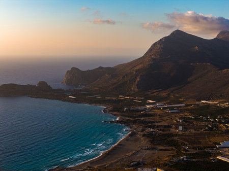 Aerial View of Crete Island Coastline with Mountains and Turquoise Waters