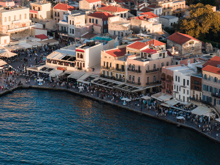 Aerial View of Chania Waterfront with Colorful Buildings at Sunsetの写真素材