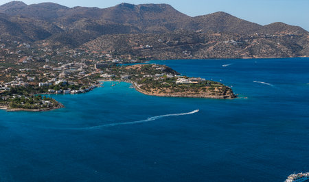 Aerial View of Agios Nikolaos with Peninsula and Turquoise Watersの写真素材