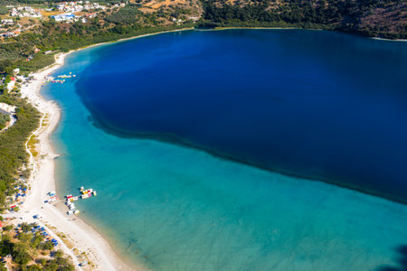 Aerial View of Lake Kournas with Turquoise Waters and Sandy Beachの写真素材