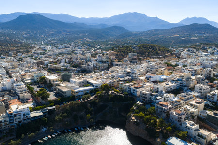 Aerial View of Agios Nikolaos with Harbor and Mountain Backdropの写真素材