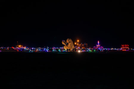 Illuminated Lion Sculpture at Nighttime Burning Man Festival in Nevadaの写真素材