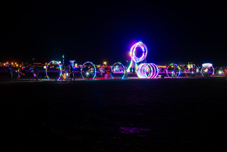 Nighttime View of Neon Art Installations at Burning Man Festivalの写真素材