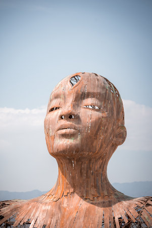 Large Metal Sculpture of Human Head at Burning Man in Nevada Desertの写真素材