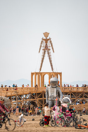 Wooden Humanoid Sculpture and Astronaut Art at Eventの写真素材