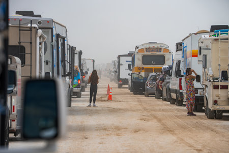 Dusty Road with RVs and Buses at Burning Man Festival in Nevada