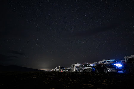 Nighttime View of Parked Vehicles Under Starry Sky at Burning Man 2025