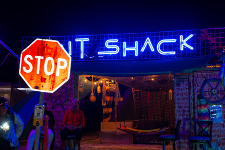 Nighttime View of IT Shack Neon Sign at Burning Man Festival 2025の写真素材