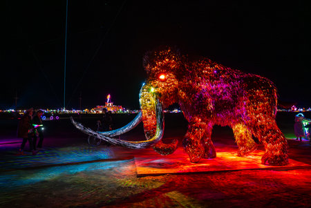 Illuminated Mammoth Sculpture at Night in Nevada Desert Festivalの写真素材
