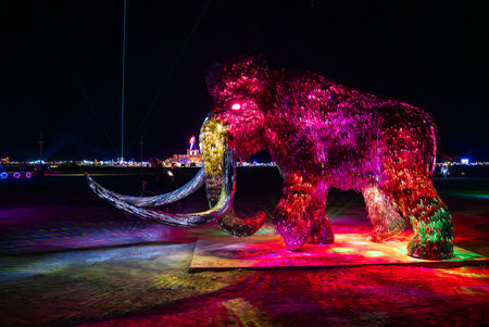 Illuminated Mammoth Sculpture at Night in Nevada Desertの写真素材