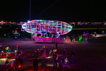 Illuminated Art Installation and Festival Goers at Burning Man